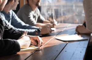 Business people sitting around a table 